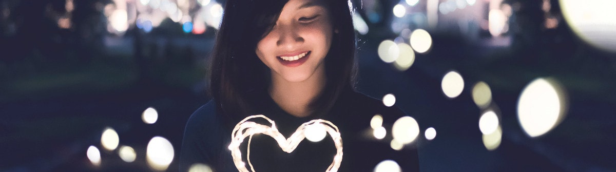 young lady with glowing heart