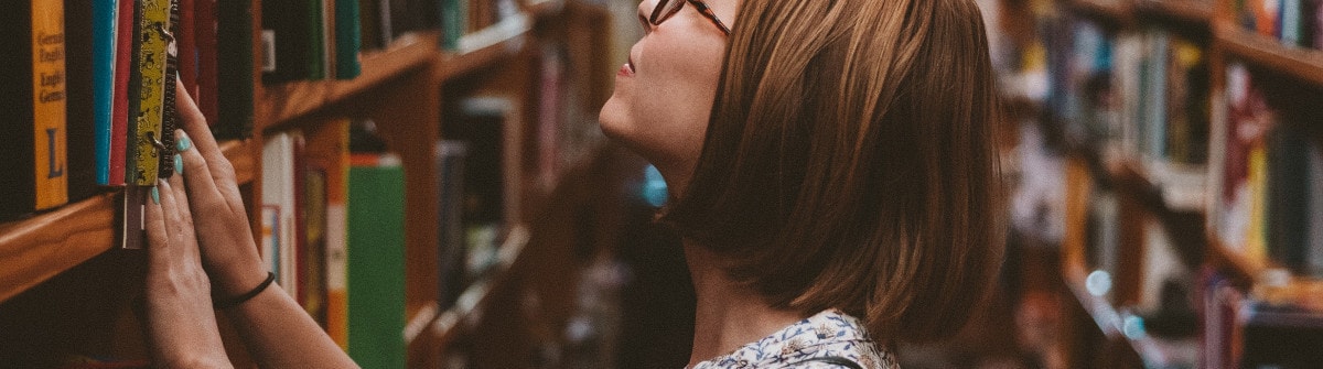 woman looking in library